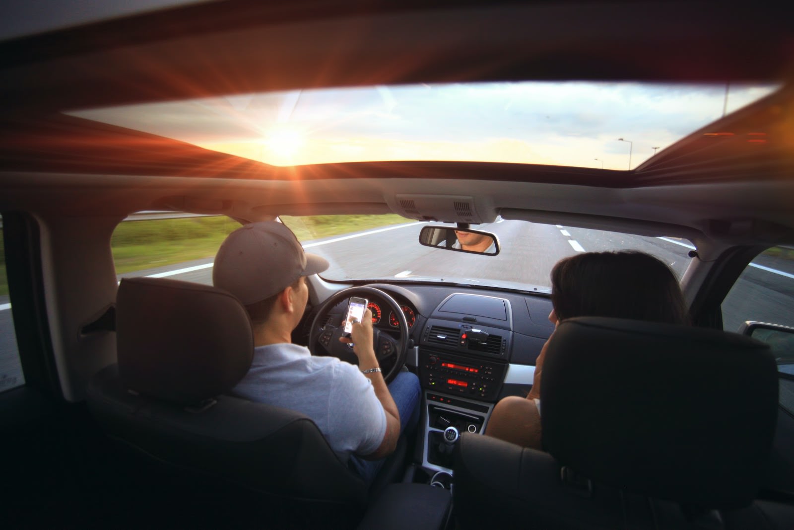 a man on his phone while driving