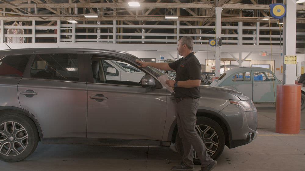 a car being inspected for an estimate