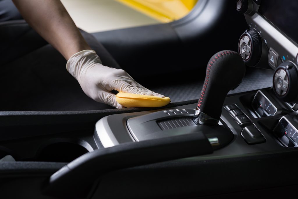 wiping car interior to disinfect it